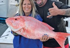 Mick and Michelle with a giant Red Snapper caught with Fishing Headquarters.