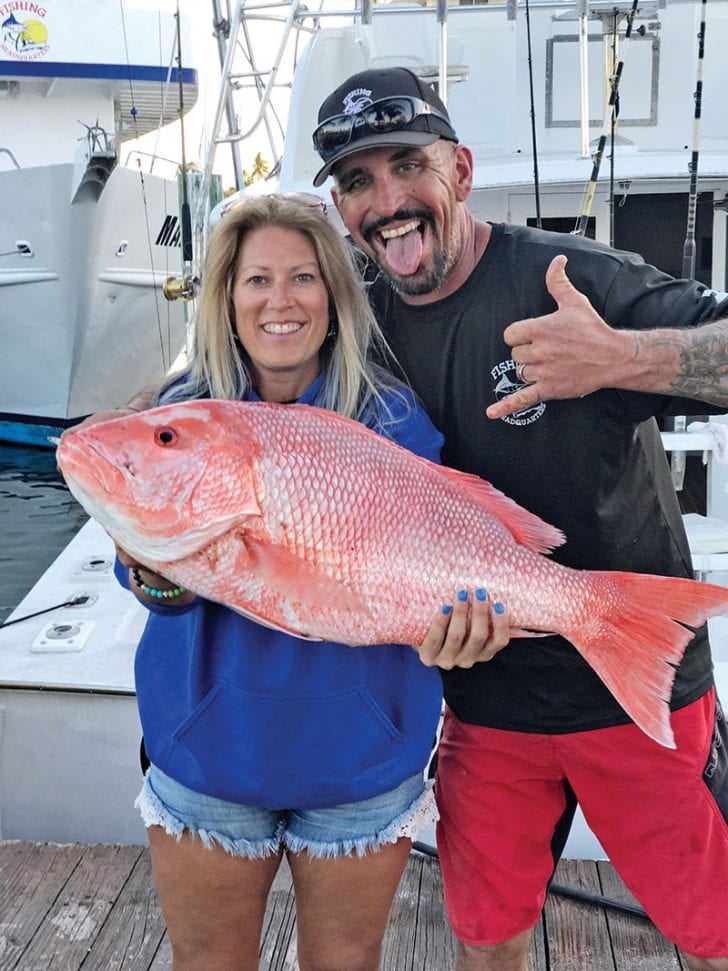 Mick and Michelle with a giant Red Snapper caught with Fishing Headquarters.