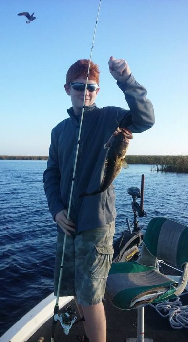 Nice catch while fishing with his dad, brother and Capt. Eddie Perry. Photo credit: Capt. Eddie Perry.