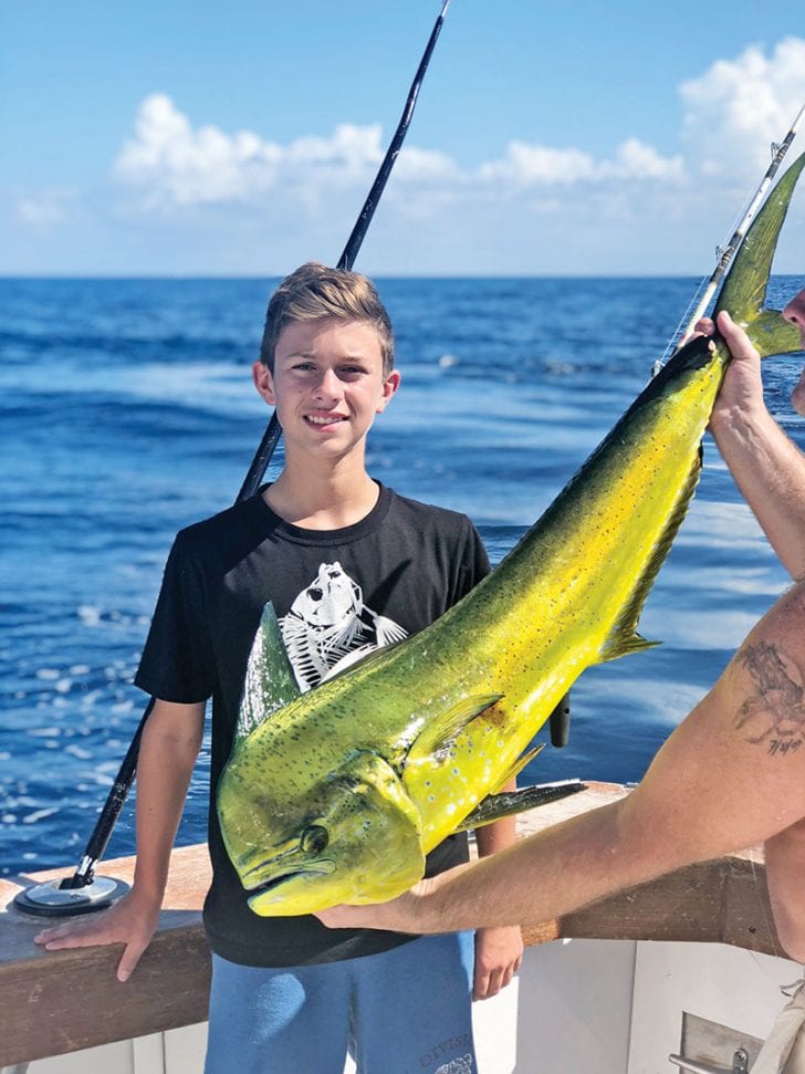 Nice dolphin caught by this young angler aboard the New Lattitude.