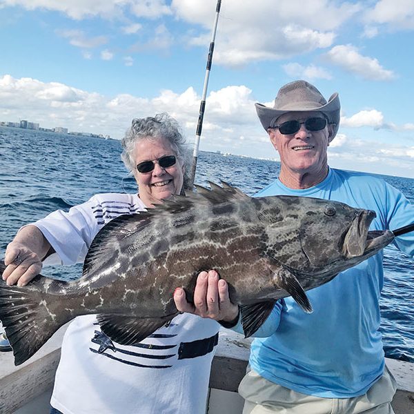 Nice grouper for these happy anglers aboard the 'New Lattitude' Sportfishing Boat.