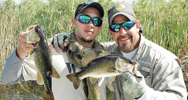 U.S. Marine Jose Jr. caught some largemouth bass fishing deep in the Everglades with Capt. Neal Stark.