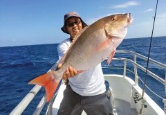 Orlando with a monster mutton snapper caught aboard the Catch My Drift.