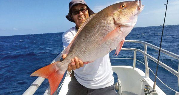 Orlando with a monster mutton snapper caught aboard the Catch My Drift.