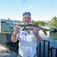 Mark Finch with freshwater snook caught on a live shiner at the Sewell lock in Davie.
