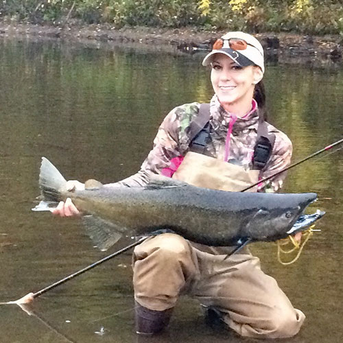 “The Most Wonderful Time of the Year”... Reflections on the Salmon River Run of 2016 BY Rachel Lynn Vickers, Angler Magazine Field Expert, and GSLFF Chair Member As you read the beginning title of my story most people think of the holidays & Christmas, but for most Upstate New York Anglers that time comes a bit earlier in September thru October in the form of a massive spawning migration of over half a million 3-4-year-old chinook (Oncorhynchus tshawytscha) AKA King, and coho (Oncorhynchus kisutch) salmon from Lake Ontario into its largest surrounding cold water tributary, the Salmon River Corridor/watershed. This 17-mile-long stretch of river 12 of which are public access and its tributaries Trout Brook, Orwell Brook, and Beaver Dam Brook support and sustain a true world class fishery, due to its outstanding water quality and help from the DEC funded Salmon River Hatchery which was opened in 1980. This facility provides most of the fish for the now multi-million dollar Lake Ontario salmonid fishery, with over 3.5 million salmonids and trout produced yearly. When it comes to this time of year, thousands of anglers from novice to professionals ascend on the rural towns of Altmar, Pineville, Pulaski, and Port Ontario, with the opportunity for all to catch large trophy sized salmon. The Salmon River fishery has produced the state record for both coho and chinook salmon, drawing fish enthusiasts from surrounding states and further states like California, Colorado, Florida, and as distant as England, Ireland, Switzerland, Australia, and China! In turn, the economic influx is essential for the surrounding towns’ many diverse local and seasonal businesses to remain, and grow thru out the years. This makes it possible for us anglers to experience, and share this truly amazing, unique world renowned fishery with friends, and future generations of anglers “in the making” to come. I consider myself very privileged to have a friend, a fellow graduate from Cobleskill who has rental properties, and lives on the river at Port Ontario, just before the Douglaston Salmon Run (DSR) begins. I have been able to experience, and fish the” Run” for the past 12 years. From where I live, the Salmon River is only a 2 ½ hour drive. I would wait for the call in late September early October, pack my gear, drive up and get in a good weekend of fishing. This season I was able to spend 4 consecutive, extended weekends up there most of the month of October. Everyone I interviewed and spoke to from business owners to fellow anglers along the river said the same thing. They all agreed this year was different, it was the most successful and bountiful run they had experienced in the last 3-4 years. Karen Ashley, a manager at Woody’s Tackle and gifts on rt.3 in Pulaski says that about 50 percent of their yearly business comes from the Salmon Run and following trout seasons. She described the overall attitudes as “excited & polite” in regards to visiting fishermen. Woody’s is open year-round, it also provides hunting gear and serves as the weigh station for all the local fishing derby’s, and instruction to 1st time salmon anglers. Across the Street in a tiny shack with a pop up canopy attached, where a small fish cleaning station owned by Kevin DeOrnellas. Kevin comes up for 8 weeks a year to earn a quick profit cleaning salmon and then heads back home to Lincoln, Michigan. He told me he has seen more anglers catching their daily limit of fish on a consistent basis this year compared to previous runs. Which pleases both the anglers and businesses who profit from their catches. There is no doubt on the positive impact this sustained fishery has on both the economics and ecology of the area. It has been named as one of the top fishing destinations in the country, and if you have ever experienced it, you will agree that there is no other fishing experience like it. This year I was fortunate enough to witness and film my 14 year old son hook, fight and land his very first King Salmon. A very proud Mom moment for myself, as many parents have shared when they brought their children to this very special fishery, during the most wonderful time of the year for angling enthusiasts. 