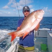 Ryan with a nice mutton snapper caught aboard the Catch My Drift.