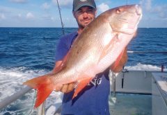 Ryan with a nice mutton snapper caught aboard the Catch My Drift.