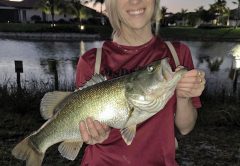 Haley Parrish with her very first largemouth bass.