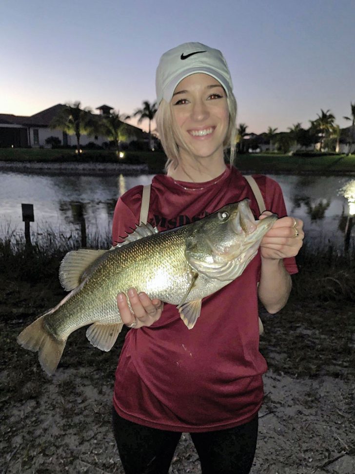 Haley Parrish with her very first largemouth bass.