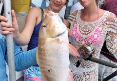 These gals caught a nice mutton snapper aboard the Catch My Drift.