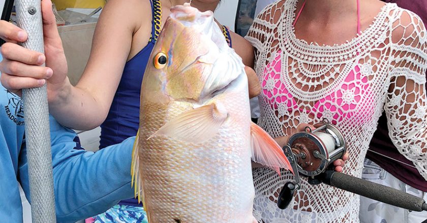 These gals caught a nice mutton snapper aboard the Catch My Drift.