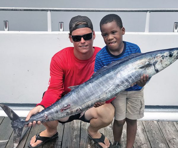 Tyler helped this kiddo catch this nice wahoo fishing with Fishing Headquarters.