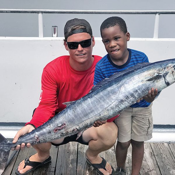 Tyler helped this kiddo catch this nice wahoo fishing with Fishing Headquarters.