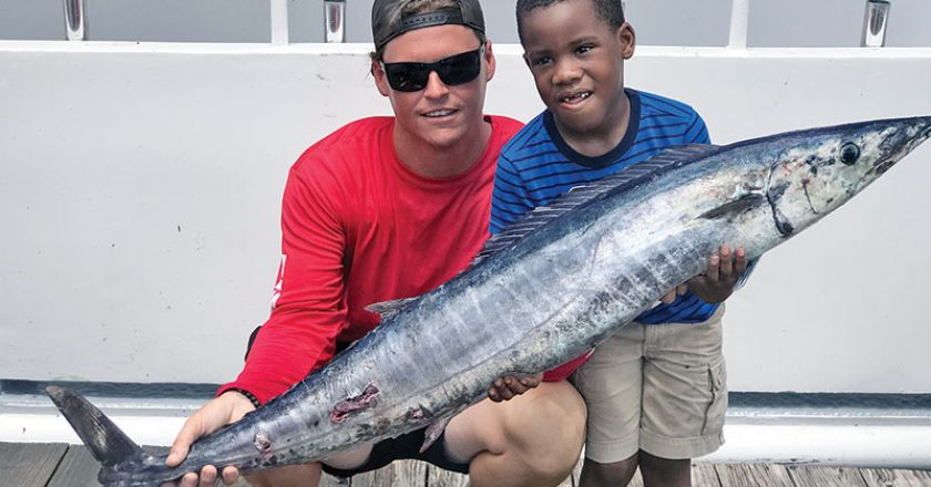 Tyler helped this kiddo catch this nice wahoo fishing with Fishing Headquarters.