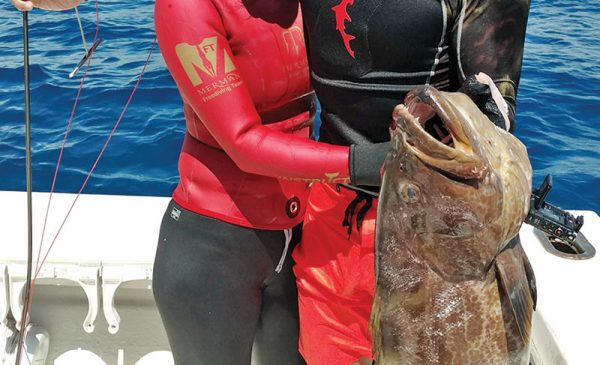 Wayne and Yen with a personal best 31 inch black grouper.