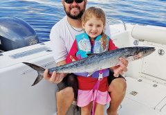 Four year old Caylee Dyer caught her first kingfish with a little help from her dad.