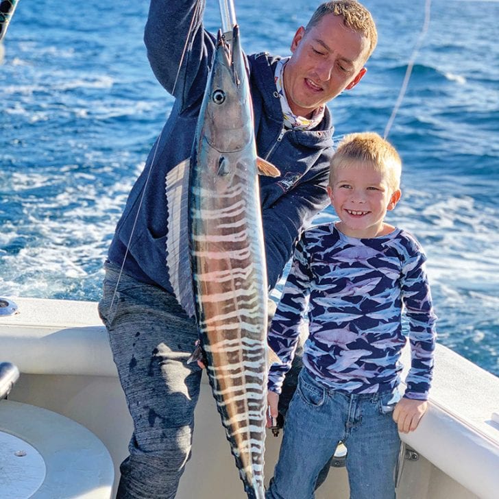 All smiles for this junior angler with his first wahoo.