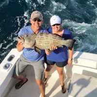 This couple scored a nice grouper aboard the Big Game.