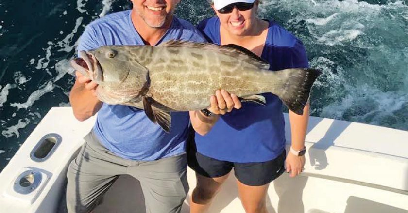 This couple scored a nice grouper aboard the Big Game.