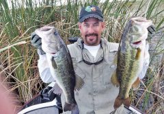 Capt. Neal with a pair of big Lake Okeechobee bass.