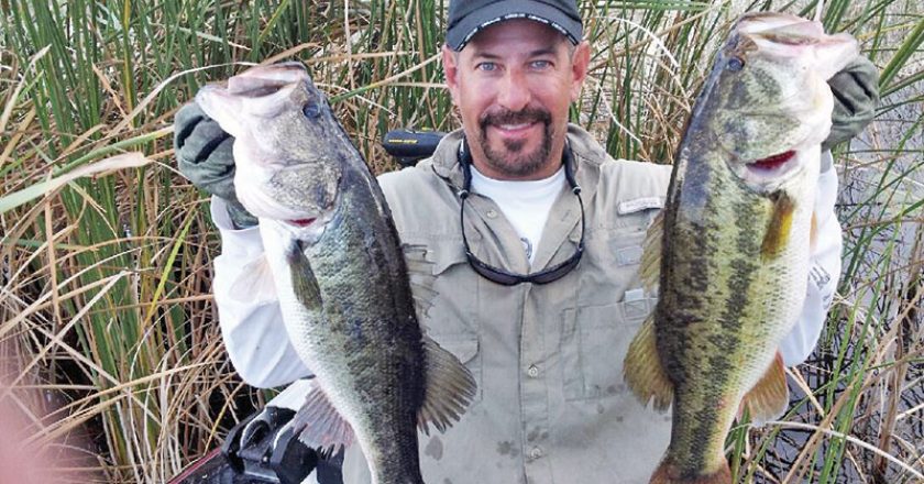 Capt. Neal with a pair of big Lake Okeechobee bass.