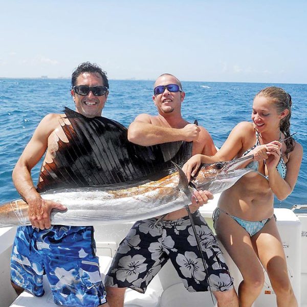 Ali caught her first sailfish with Team Nice Racks and it was love at first sight.