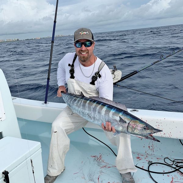 Capt. Ryan Palmer with a solid wahoo caught high speed trolling in 200 feet of Fort Lauderdale.