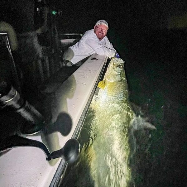 Win Farnsworth with a huge tarpon caught and released with South Florida Fishing Charters.