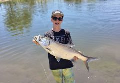 Kai Hobbs was fishing for bass with live bluegill and, when he hooked up, thought he had a pond record bass until he saw it jump and realized he caught his first freshwater tarpon!