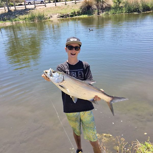 Kai Hobbs was fishing for bass with live bluegill and, when he hooked up, thought he had a pond record bass until he saw it jump and realized he caught his first freshwater tarpon!