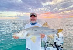 Mark with a nice beach snook in the mullet run.