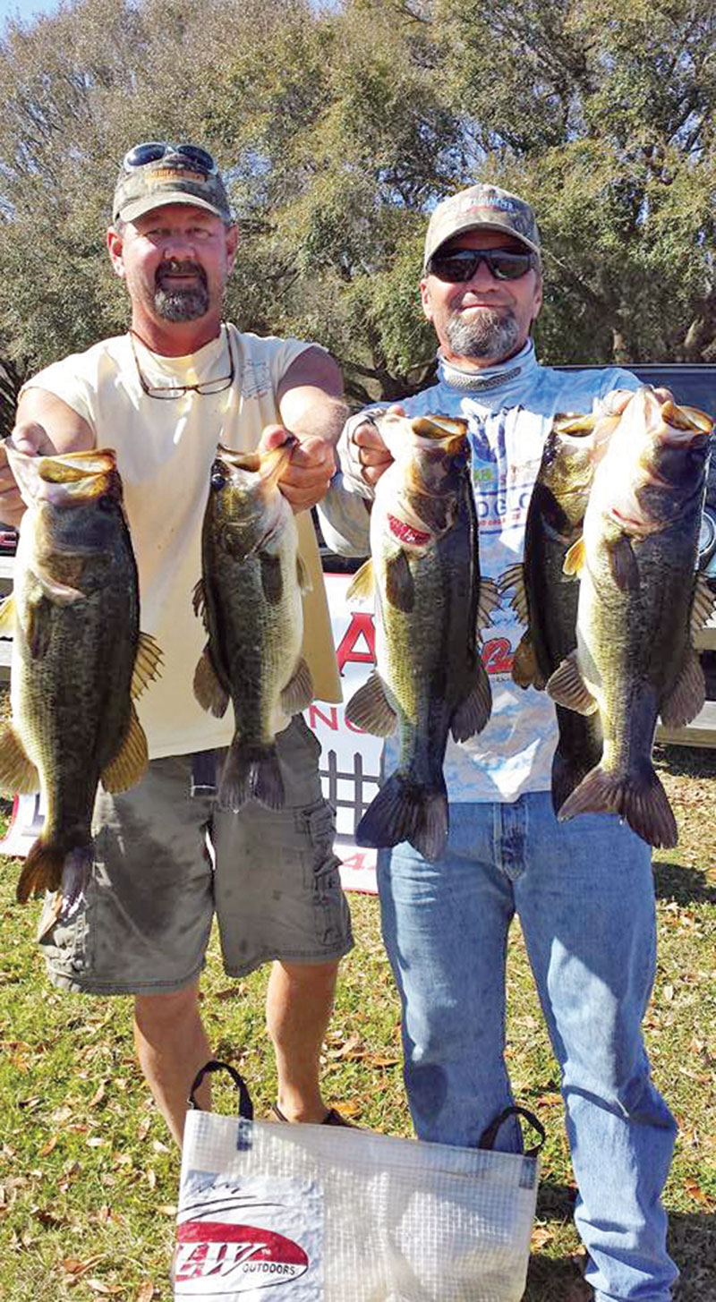 A rare photo of Capt.’s Cliff Mundinger and Randy Cnota with a nice haul of Jackson bass.