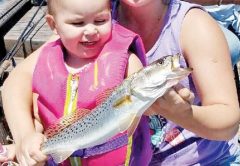 Adelynn “Creek Chub” Hallett and Allison Possum Hellet of PC with a nice trout.