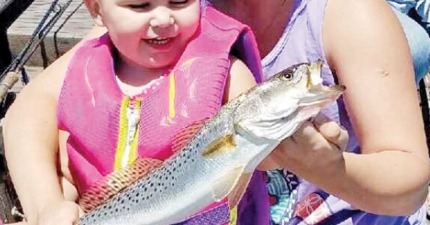 Adelynn “Creek Chub” Hallett and Allison Possum Hellet of PC with a nice trout.