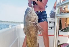 Andi Holmes had a time with this big black drum fishing with Capt. Jason.