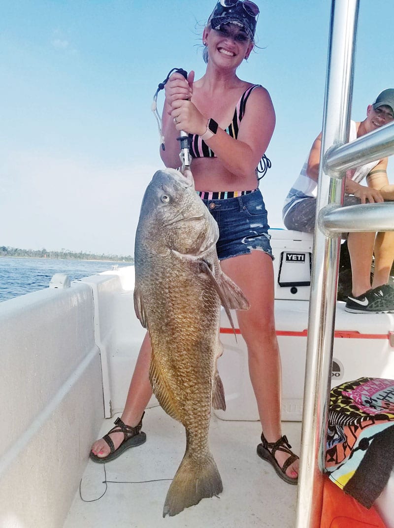 Andi Holmes had a time with this big black drum fishing with Capt. Jason.