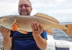 Butch Jobe with a nice redfish caught with Capt. Jason.