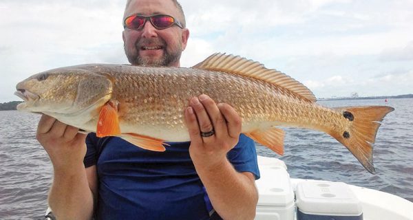 Butch Jobe with a nice redfish caught with Capt. Jason.