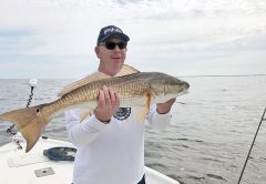 Capt. Brad Bishop putting clients on some quality Choctawhatchee Bay reds.
