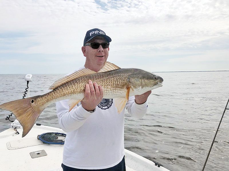 Capt. Brad Bishop putting clients on some quality Choctawhatchee Bay reds.