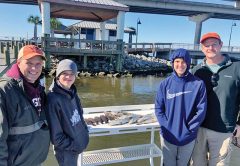 Capt. Brad of Choctawhatchee Bay Fishing Charters putting clients on the fish.