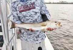 Capt C-note with one of the many big trout our bay system has been kicking out.