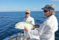 Capt. Chester holding a jack crevalle caught by Sherry Schmitt.