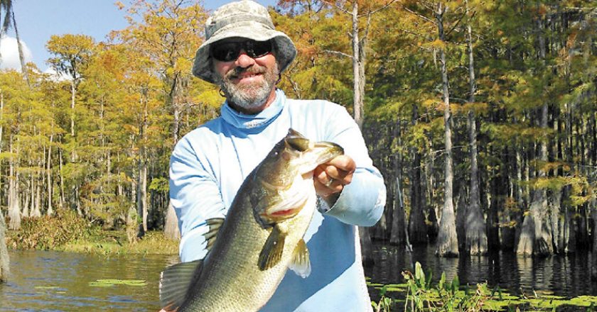 Capt. C-note with a 7 lb. Dry Lake bass.