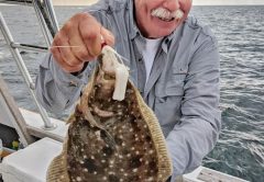 Capt. Chester Natural World Charters with an offshore flounder.