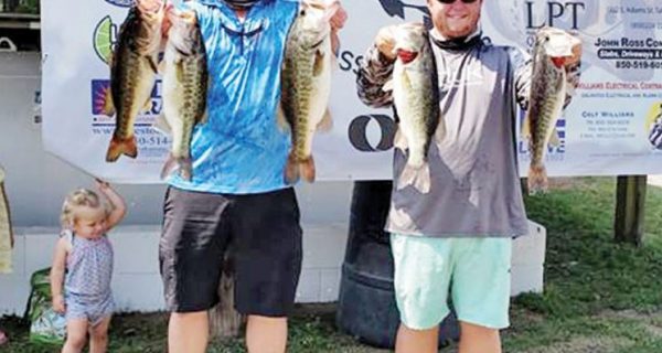 Chris Kincaid and CJ Lockamy with their winning bag of 22 pounds of Talquin bass.