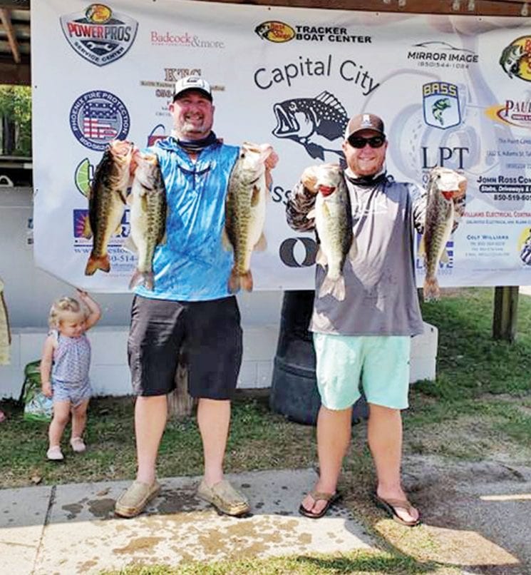 Chris Kincaid and CJ Lockamy with their winning bag of 22 pounds of Talquin bass.