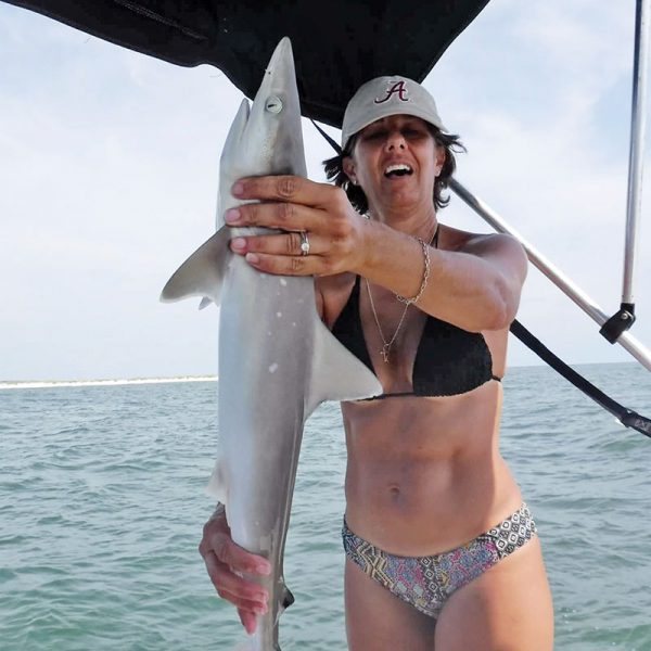 Cinda making friends with our local sharks.