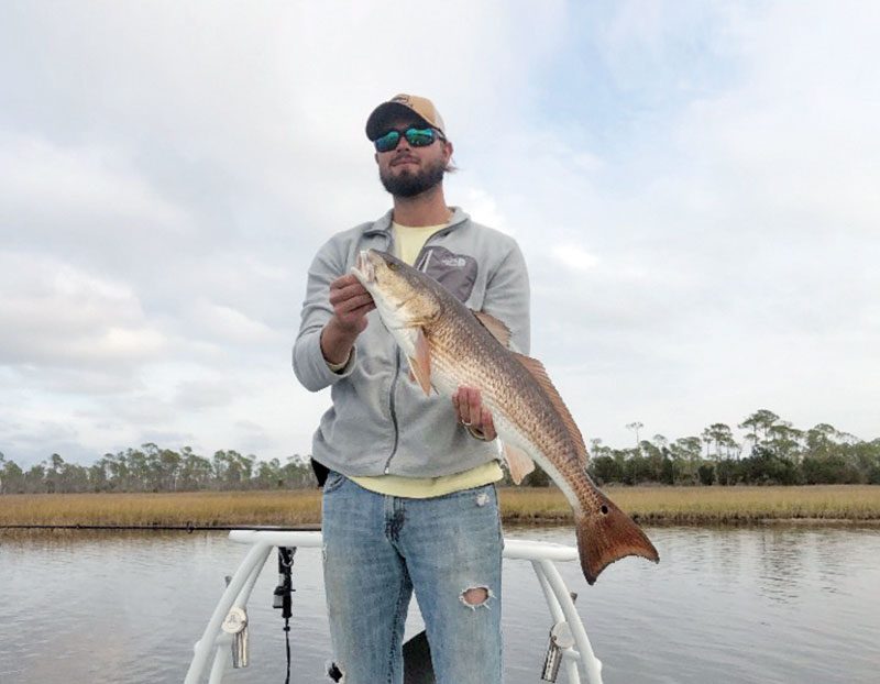 David Bender of Panama City catching winter reds.